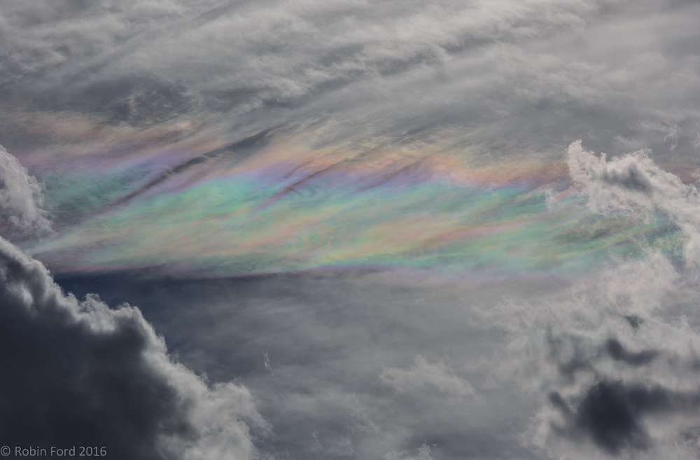 Ice crystals in the clouds causing colourful patterns